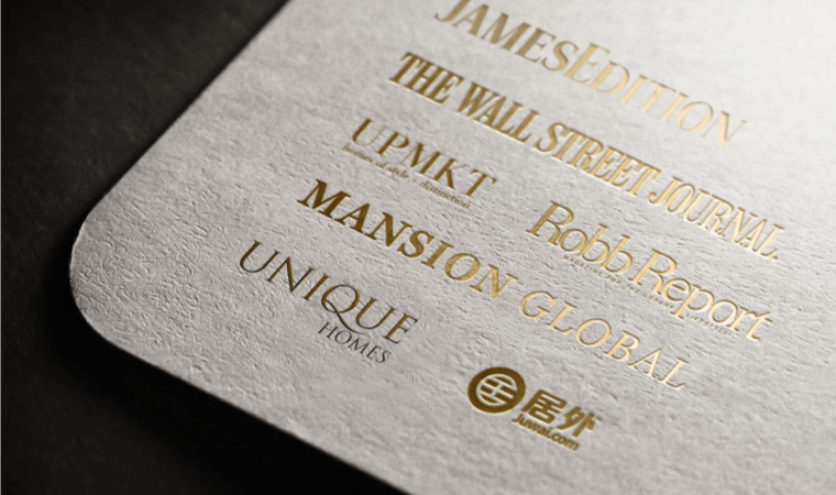 The end of a high quality cardstock with logos of global brands embossed in gold