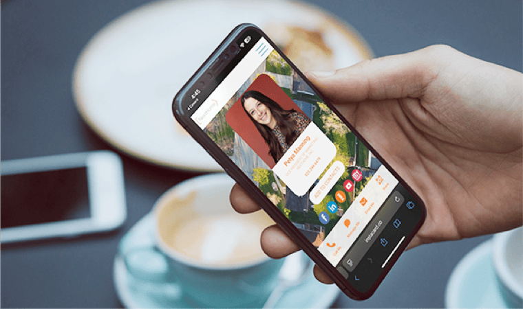 A person holding a tablet displaying a high end real estate listing